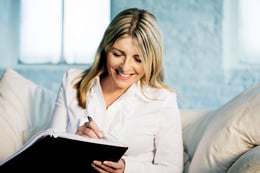 Woman writing in a notebook