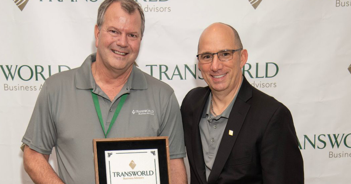 Transworld employees accepting an award