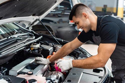 Auto - mechanic working on car - new