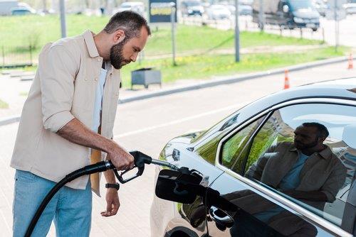 Gas - guy putting gas in 1